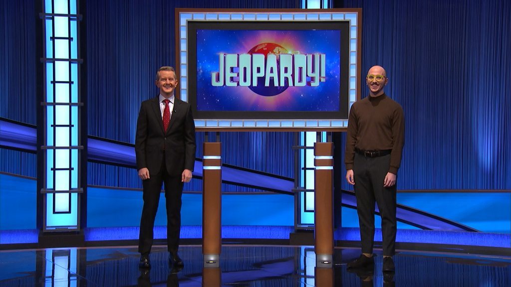 Rhone Talsma (right), Chicago Ridge Public Library's Multimedia Librarian, today defeated 40-day champion, Amy Schneider, in Final Jeopardy, walking away with $29,600. He's standing next to host Ken Jennings. (Supplied photos)