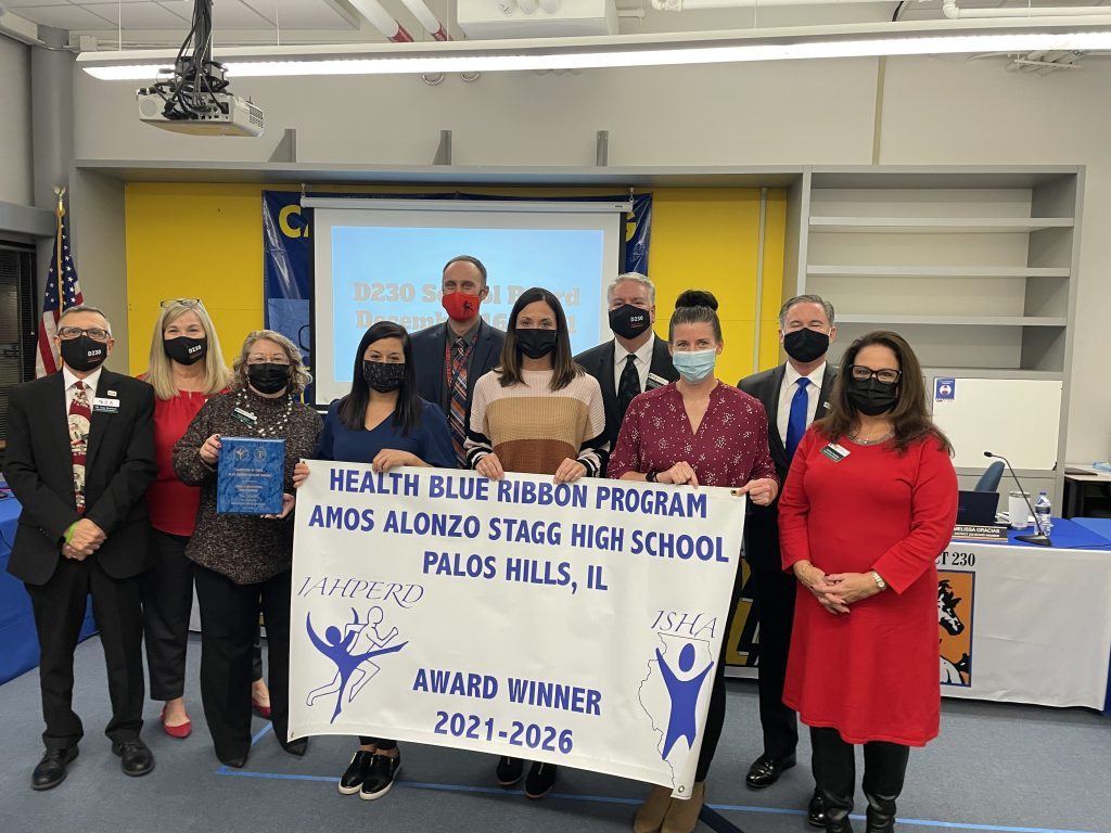 Stagg’s health team poses with the District 230 board at it was honored for winning its fourth straight Blue Ribbon award. (Photo by Jeff Vorva)