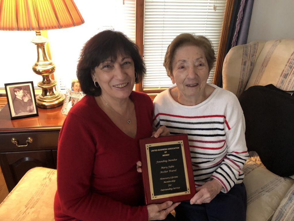 Mary Fabis (right) shows her award from Anita Cummings. --Greater Southwest News-Herald photo by Dermot Connolly