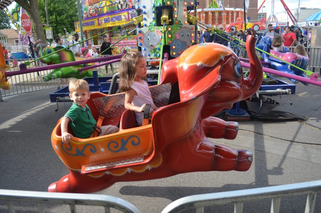 It’s not every day that a child can ride a flying elephant, but this boy and girl appeared to do exactly that at the 25th Annual St. Daniel the Prophet Parish’s Summerfest back in 2017. --File photo