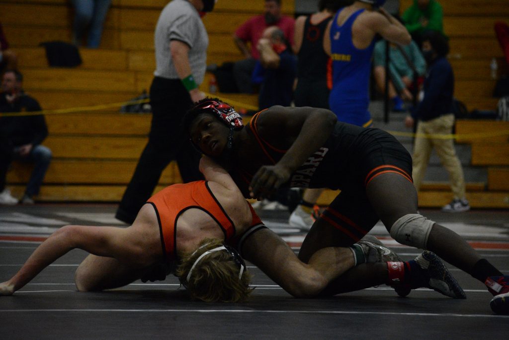 Damari Reed, seen here at a tournament in January, was one of two Shepard wrestlers to qualify for the 3A Hinsdale Central Sectional. Reed was the 152-pound champion at the Marist Regional on Feb. 5. Teammate Gabe Smith placed 2nd at 195. Photo by Jason Maholy