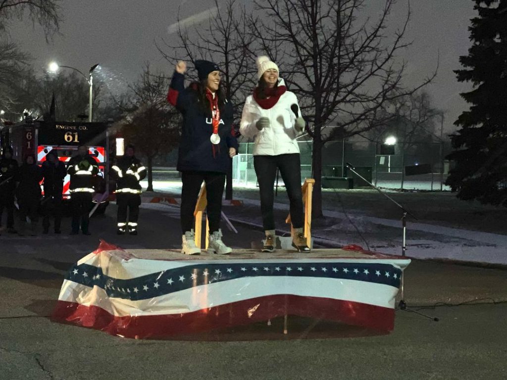 Olympic Silver Medalist Abbey Murphy was welcomed back to her home block on 92nd and Ridgeway Avenue in Evergreen Park Thursday night. She stands here alongside Evergreen Park Mayor Kelly Burke (left). (Photos by Kelly White)