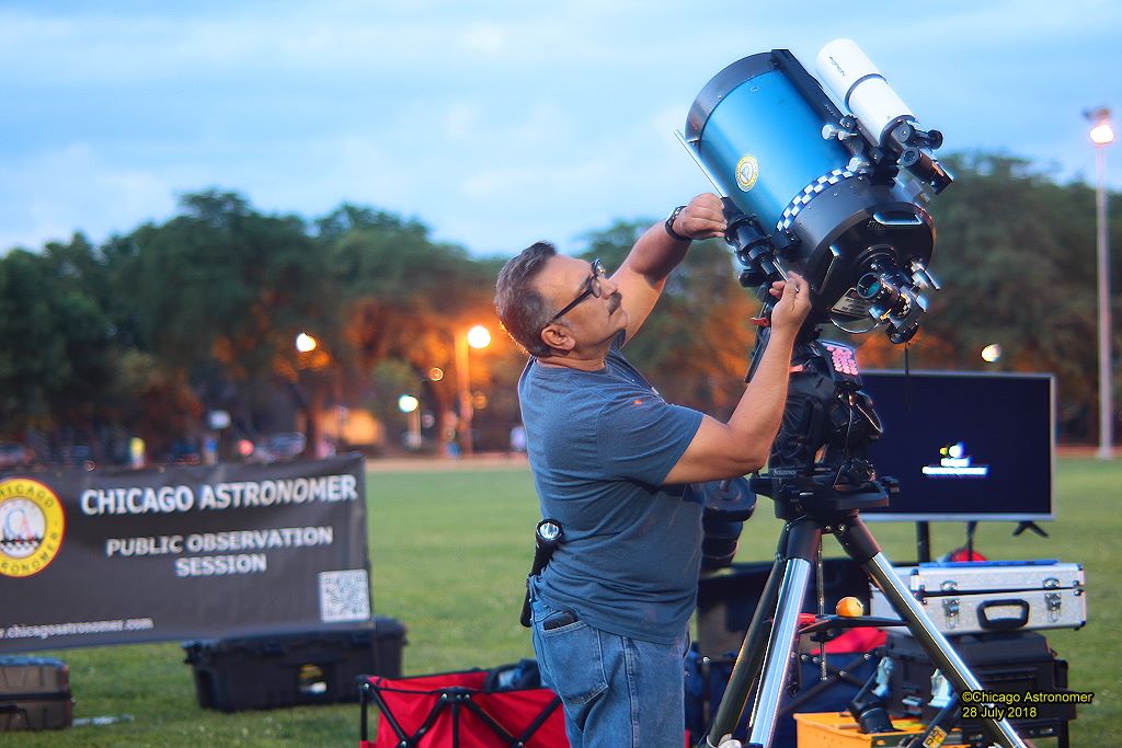 “Astro Joe” Guzman sets up one of his telescopes at an event where he encourages everyone, perhaps especially children, to enjoy the wonders of space. --Supplied photo