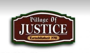village of justice est sign