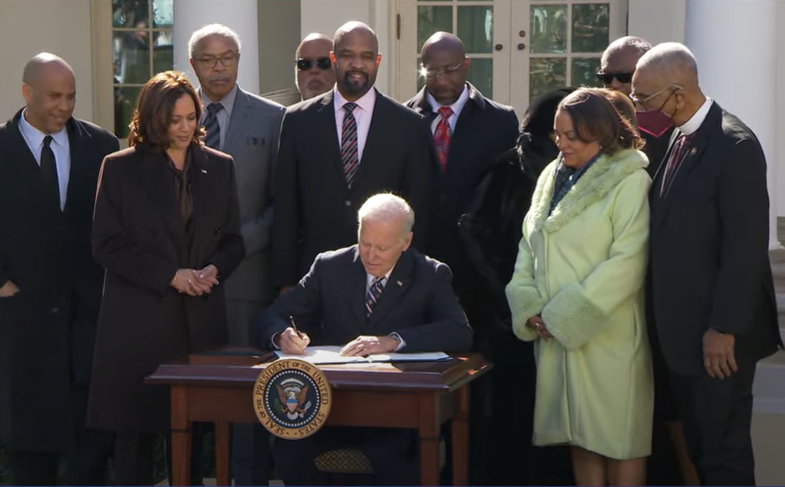 U.S. Rep. Bobby L. Rush (right) watches as President Joe Biden signs the Emmett Till Antilynching Act into law at a White House Rose Garden ceremony late last month. – Photo courtesy of Congressman Rush’s Office