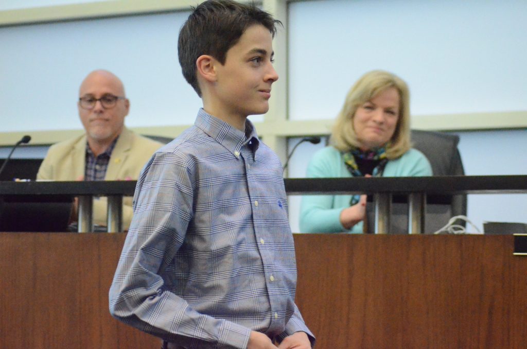 Orland Park's Luke Cudney was honored at a village board meeting for raising money for Ukraine. (Photo by Jeff Vorva)