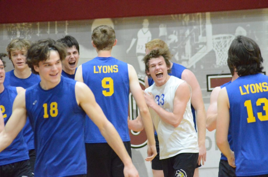 Lyons boys volleyball players have a spirited celebration after beating Lockport to win the 12-team Argo Invitational on Saturday. Photo by Jeff Vorva