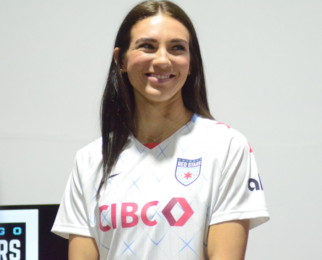 Tatumn Milazzo, an Orland Park native, shows off the Red Stars' new kit during a media day event in Chicago last Thursday. Photo by Jeff Vorva