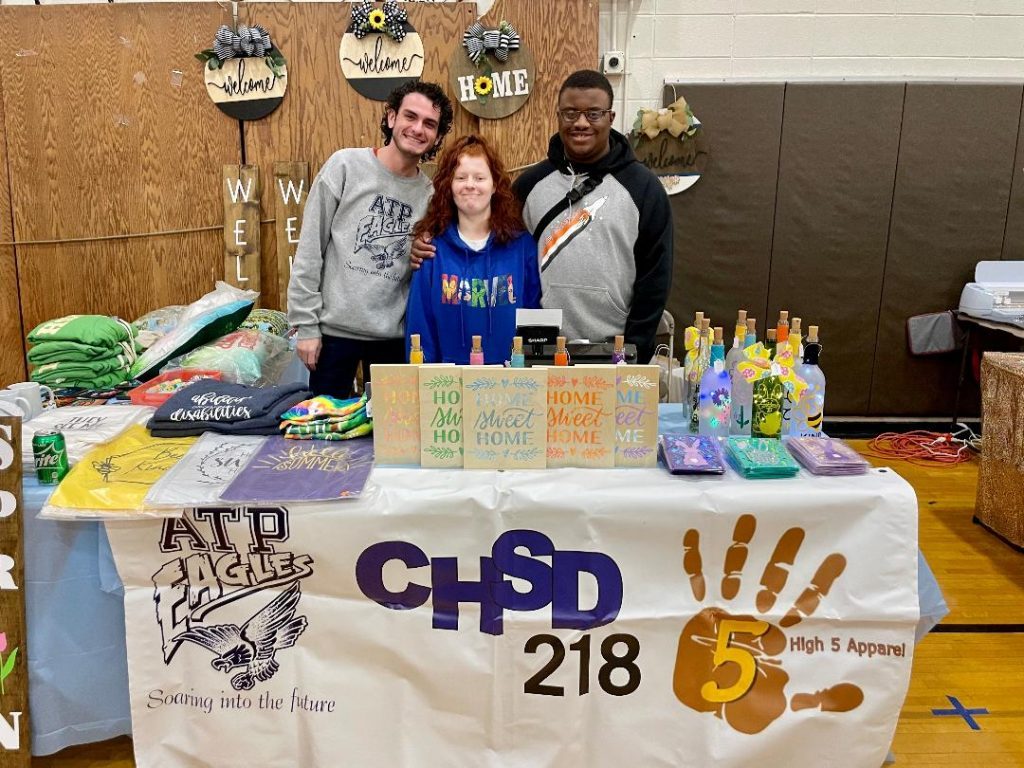 Community High School District 218 Adult Transition's High 5 Program was proud to be a part of the Shepard High School Craft Show on April 9. Pictured (from left) are student teacher, Tommy Horton, and students, Courtney Kelleck, 20, of Blue Island, and John Mackel, 19, of Palos Heights. (Photos by Kelly White)