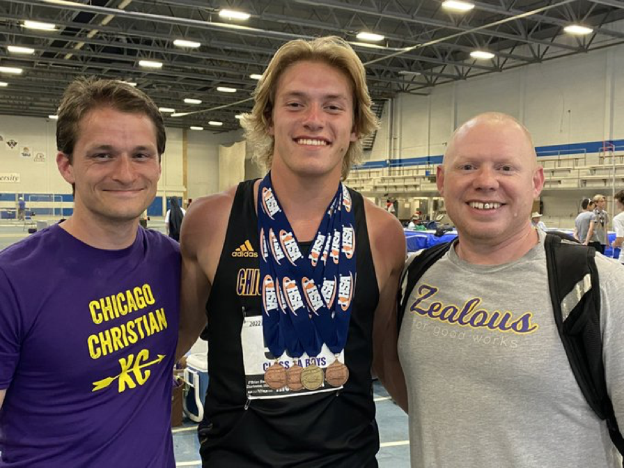 Chicago Christian's Luke Jelderks popses with his four medals with Knights coaches Jake Christiansen (left) and Jacob Goble. Photo courtesy of Chicago Christian High School