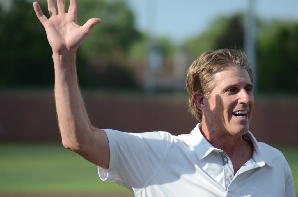 Donn Pall waves to the crowd Monday after throwing out the ceremonial first pitch before a Shepard/Evergreen Park baseball game. Pall had his number retired at EP. Photo by Jeff Vorva