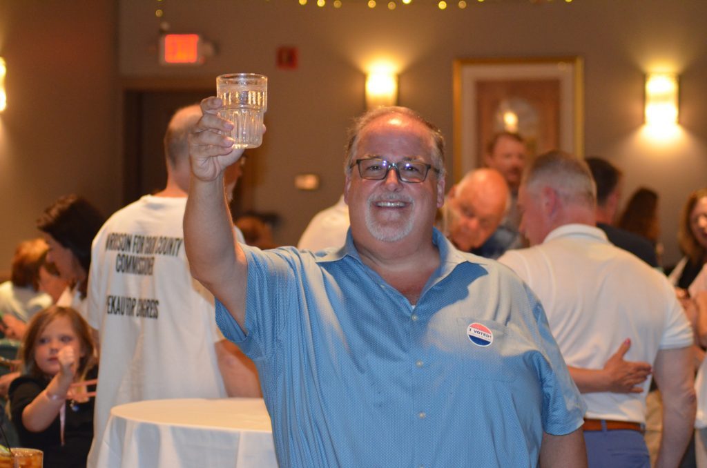 Sean Morrison toasts with a glass of water after his unofficial victory over Liz Gorman for a shot at retaining his season on the Cook County Board Tuesday night. (Photo by Jeff Vorva)