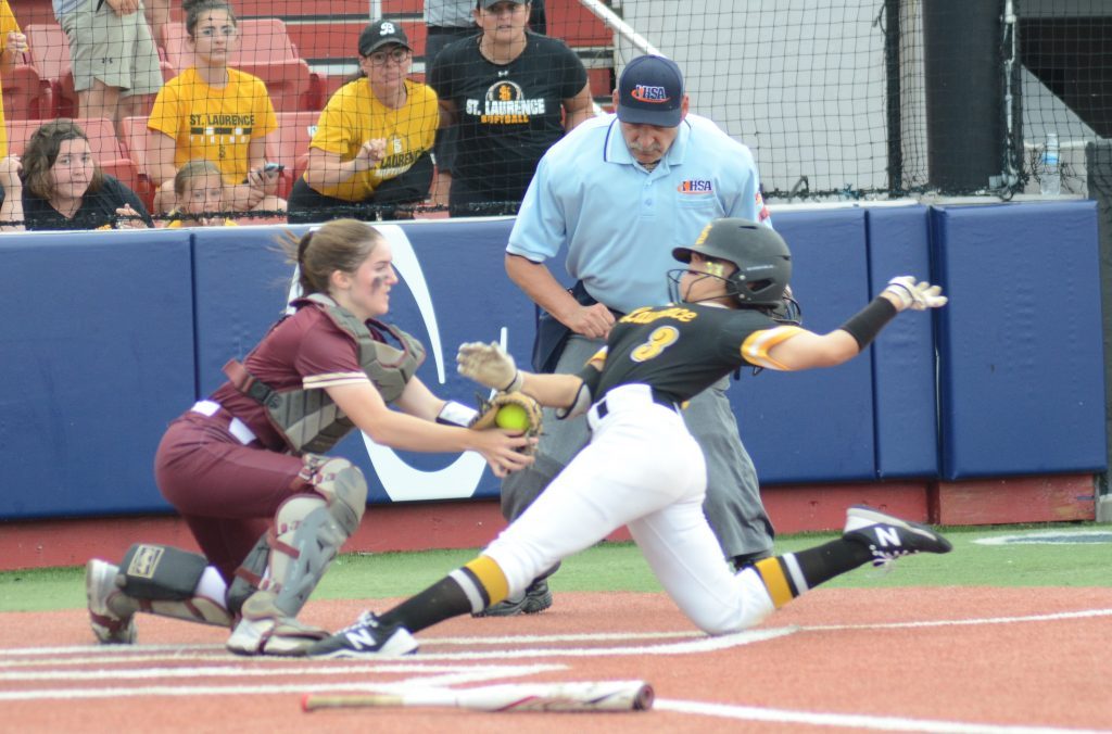 St. Laurence’s Sophia Sanchez slides on a seventh-inning play at the plate and St. Ignatius catcher Elise Wolf applies the tag. Sanchez was called out on the close play and the Vikings went on to lose, 1-0 at the Rosemont Supersectional on Monday. Photo by Jeff Vorva