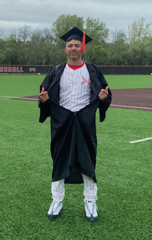 A baseball player at heart, John Cruz-Barcenas shows his Raiders uniform under his graduation gown at the Milwaukee School of Engineering. --Supplied photo
