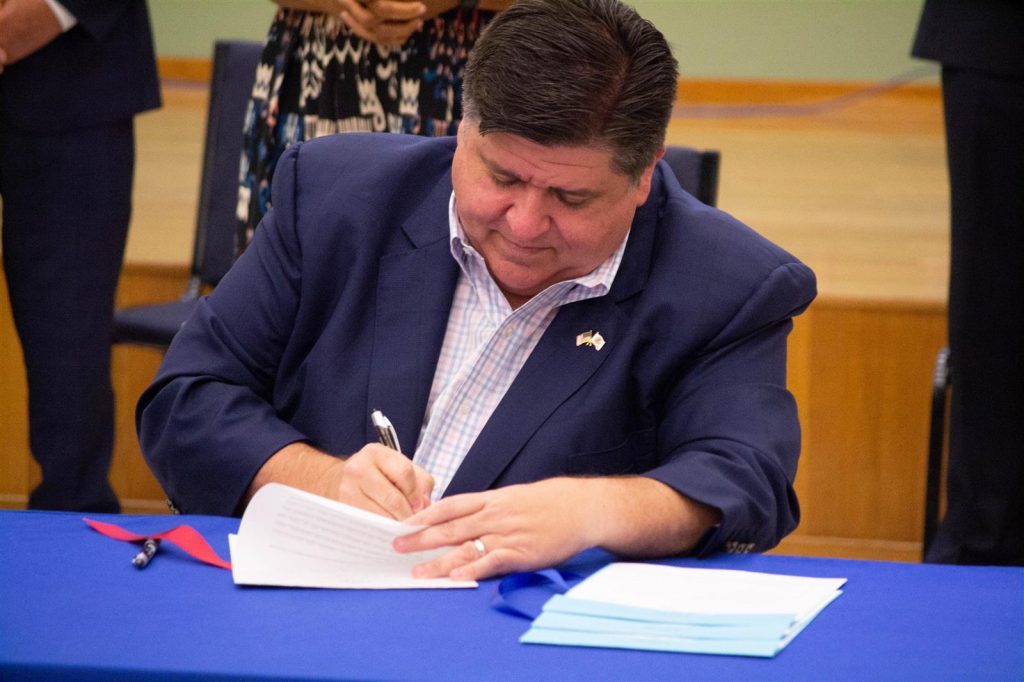 Pritzker signs bills targeting wage theft, expanding HIV care options