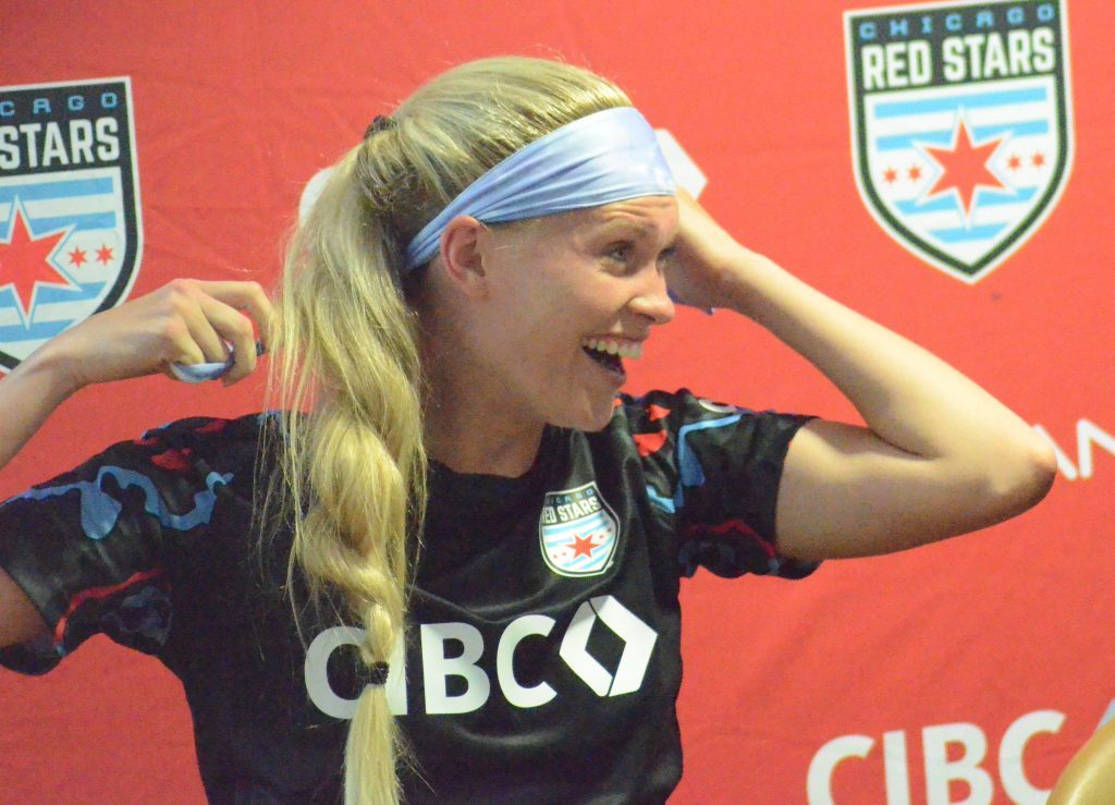 Red Stars defender Amanda Kowalski laughs as she adjusts her headband at the news conference minutes after scoring the final goal in an improbable tie over North Carolina. Photo by Jeff Vorva 
