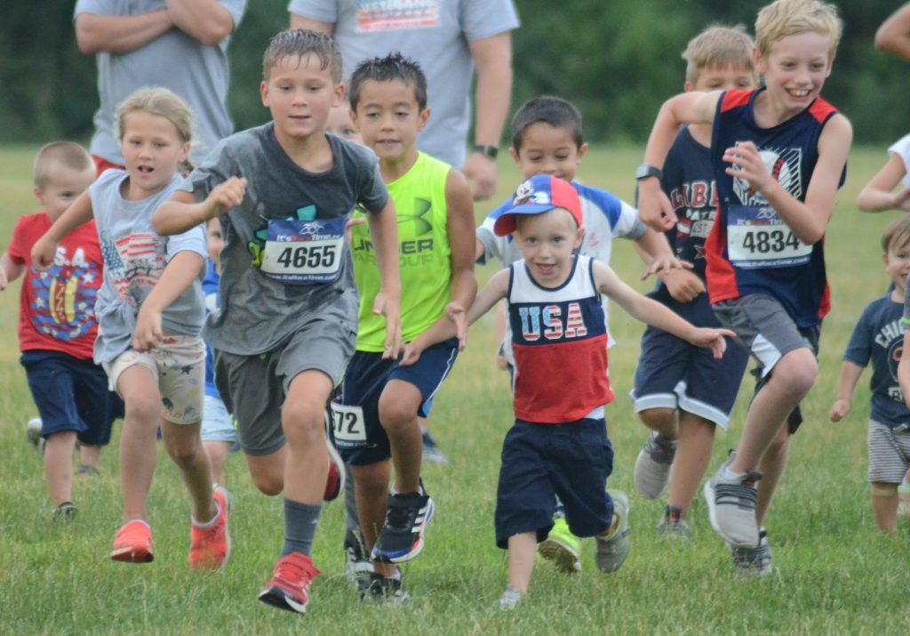 There was a lot of joy at the start of the kids' 50-yard dash at the Liberty Run. Photo by Jeff Vorva