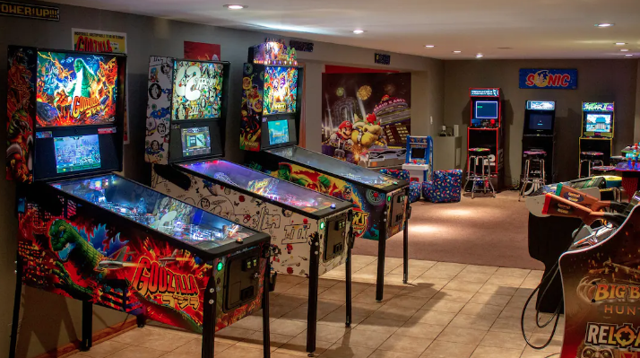 The basement of the single-family home at 5304 S. New England has been transformed into a modern game room complete with pinball machines and video arcade games. --Photo posted by the home’s owner to airbnb.com