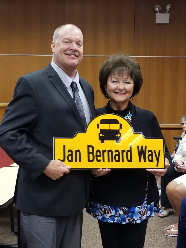 Stickney Mayor Jeff Walik and retired Edison School principal Jan Bernard show off the special street sign in her honor. (Photos by Carol McGowan)