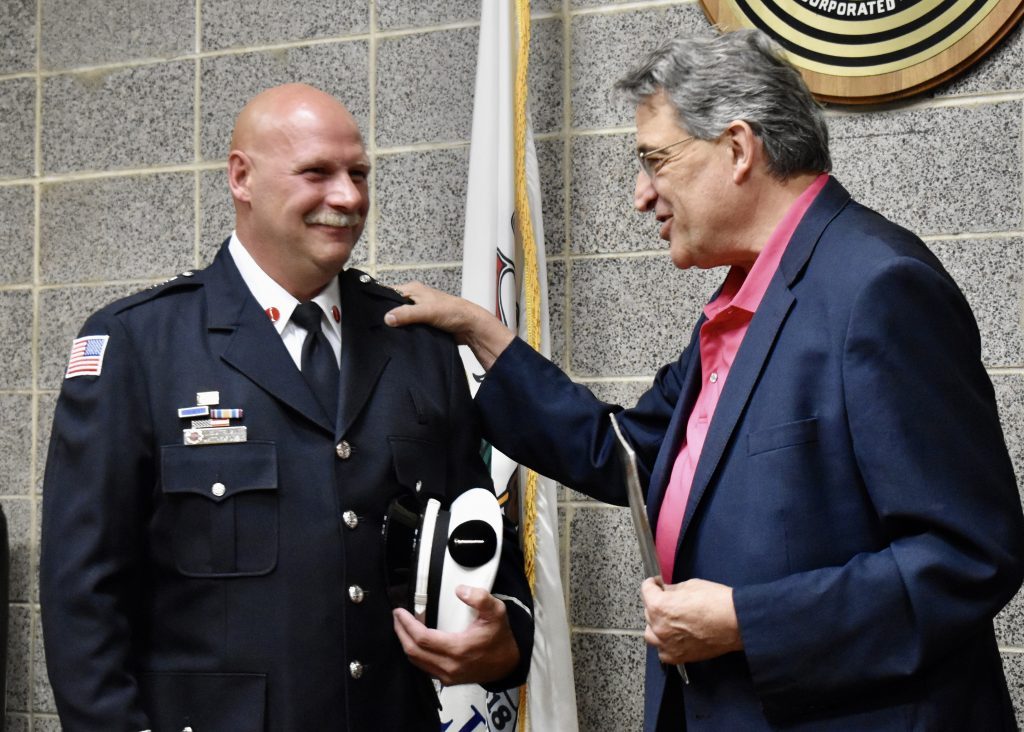 Matt Duzak, Bridgeview’s newest fire lieutenant, was sworn in by Mayor Steve Landek on Aug. 3. (Photo by Steve Metsch)
