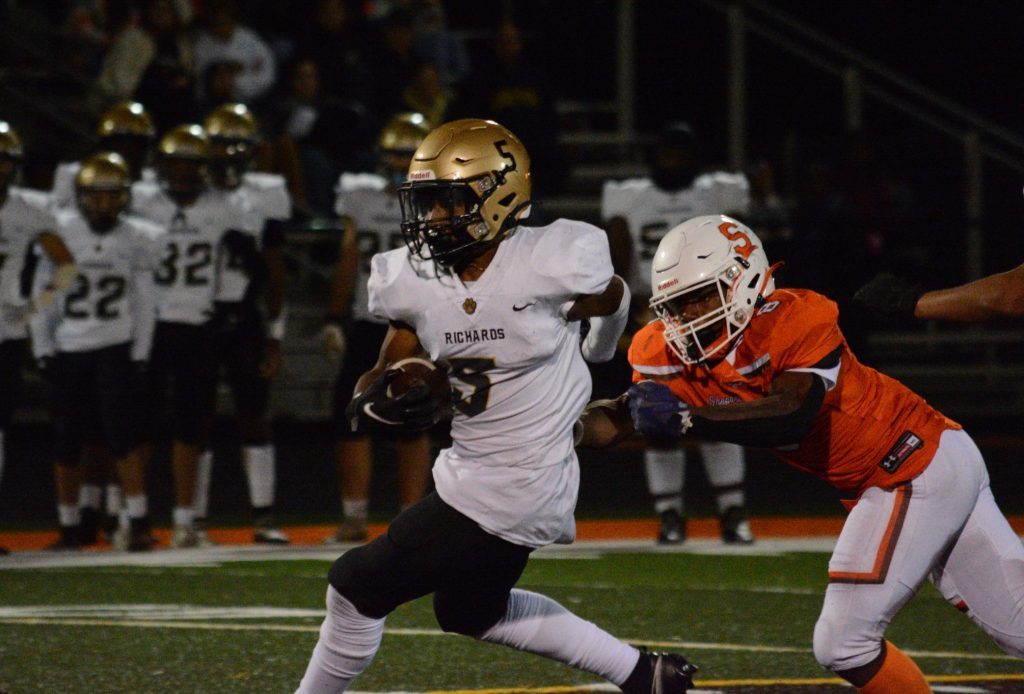 Richards sophomore running back Miles Mitchell (5) ran for 142 yards and scored four touchdowns in a 49-36 win over Shepard on Sept. 23 in Palos Heights. Photo by Jason Maholy