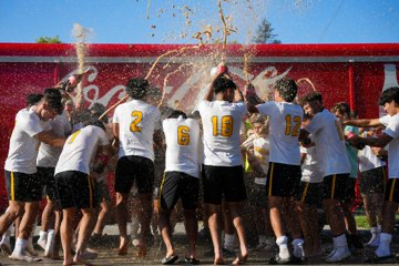 St. Laurence soccer players spray cola during a celebrating winning their division in the Bodyarmor Sports Series soccer showcase. Photo courtesy of St. Laurence