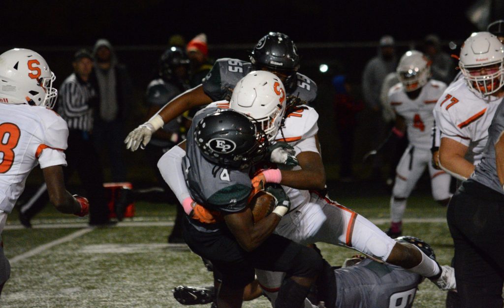 Shepard defensive end Robinson Hale lays a hit on Evergreen Park quarterback Quran McClellan during the Mustangs' 41-14 win on Oct. 7. Photo by Jason Maholy