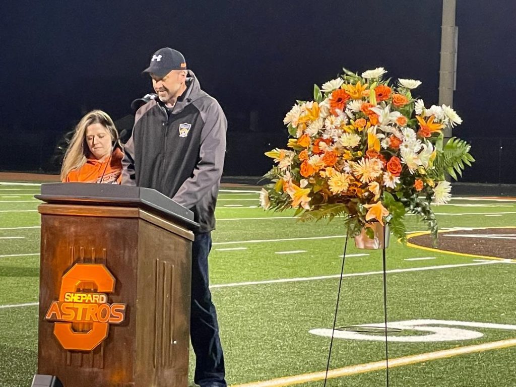 Jen and Dan Plowman talk about their son, Ryan, during a vigil held in his honor on Wednesday night at Shepard High School in Palos Heights. (Photos by Kelly White)