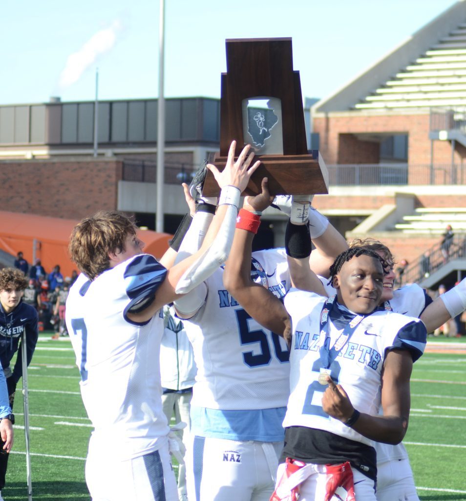 Nazareth players celebrate winning the fourth football championship in the school's history on Nov. 26 in Champaign. Photo by Jeff Vorva 