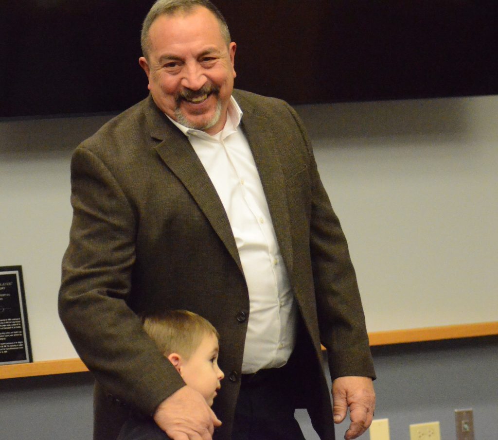 Paul Metcalf and his 4-year-old grandson, Garrett Lauwers, accept Paul's award at the Palos Park council meeting on Monday. (Photo by Jeff Vorva)