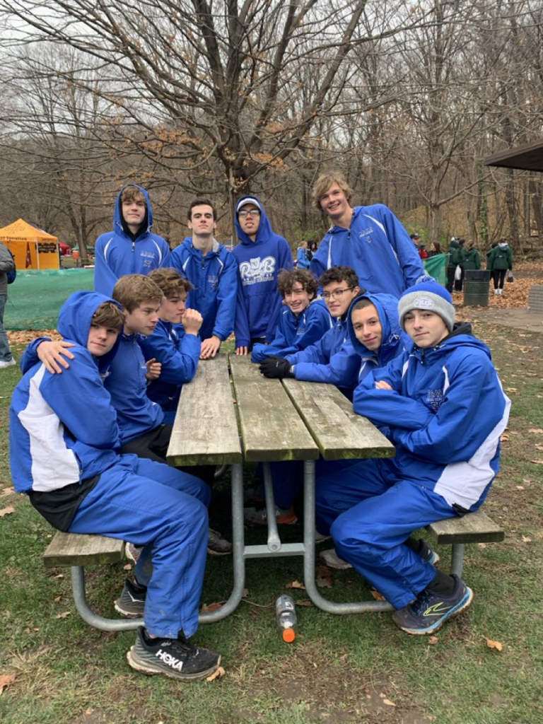 Riverside-Brookfield's boys cross country team relaxes after winning the state championship in Class 2A Saturday. Photo courtesy of Riverside-Brookfield.