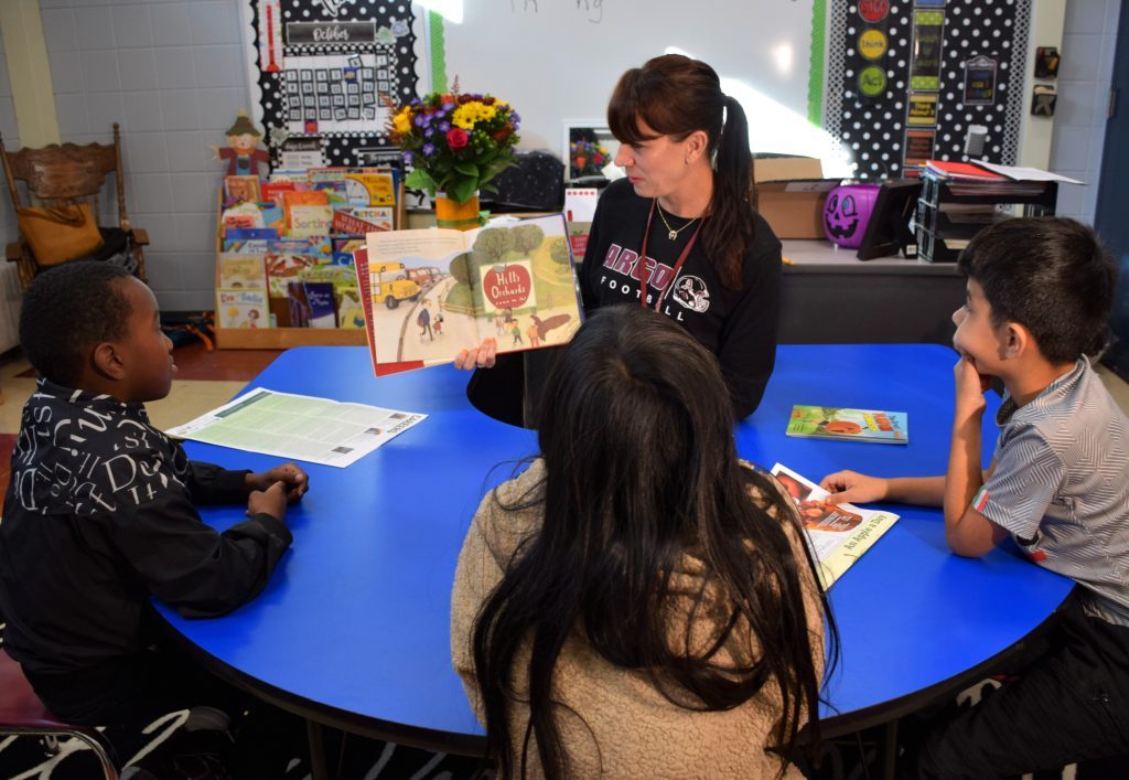 Eva Manzke reads a book about apple orchards to her students on Oct. 28. Manzke, a third- and fourth-grade teacher at Walker Elementary School in Bedford Park was named 2023 Illinois Agriculture in the Classroom Teacher of the Year. (Photos supplied by Cook County Farm Bureau)