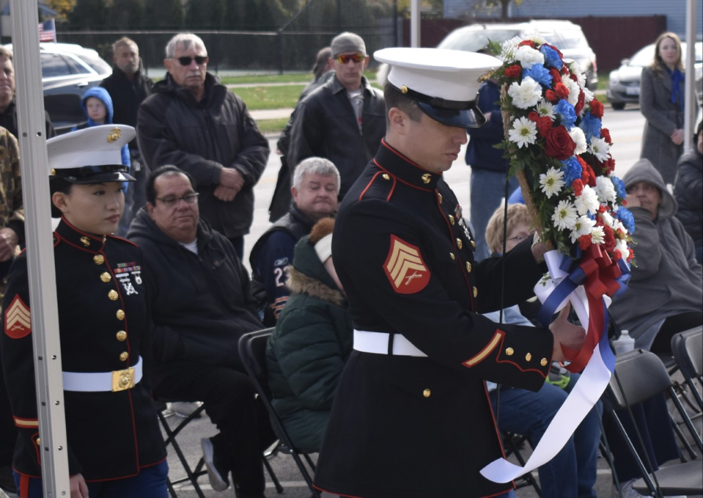 Marine Sgts. Stacy Yang (left) and Eder Carreno present the memorial wreath at Lyons Veterans Day ceremonies. (Photos by Steve Metsch)