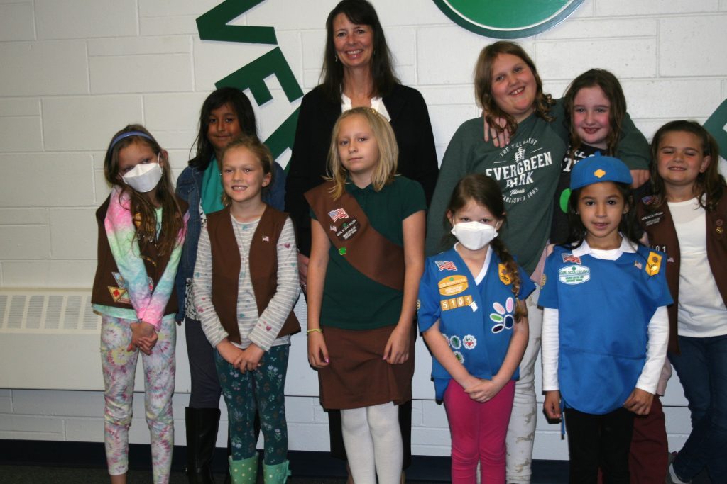 Evergreen Park Mayor Kelly Burke joins members of Girl Scout Troop 65101 for a photo during the village board meeting on Nov. 7. The scouts received a tour of the council chambers and recited the Pledge of Allegiance before the meeting began. (Photo by Joe Boyle)