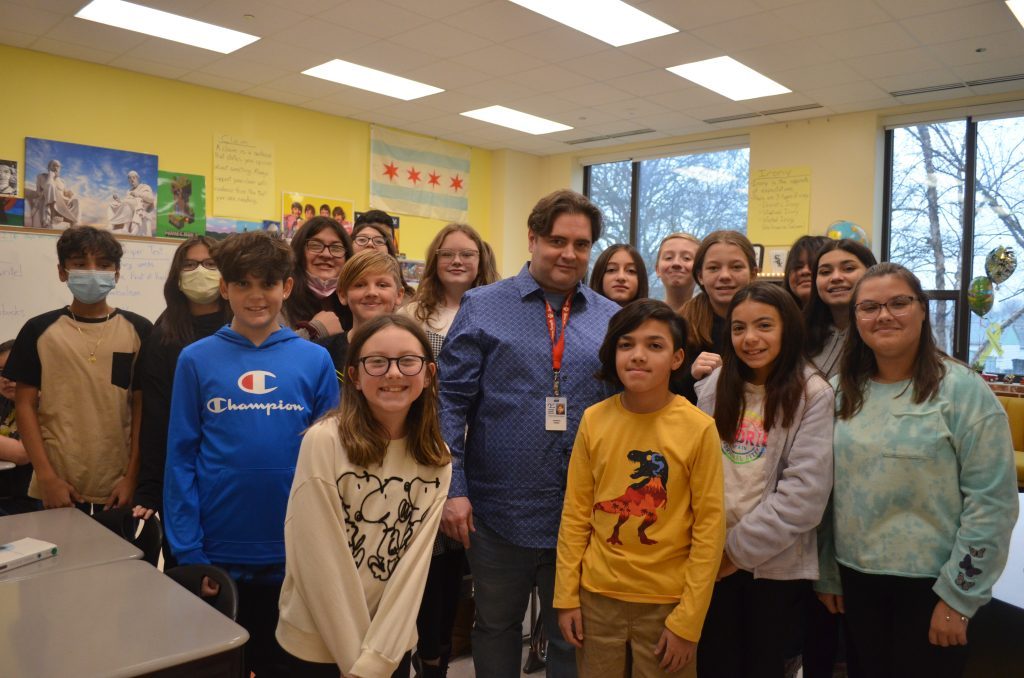 Robert Gebel, the Midway Chamber of Commerce’s 2022 Teacher of the Year, surrounded by some of his sixth grade students at Byrne Elementary School. --Greater Southwest News-Herald photo by Cosmo Hadac