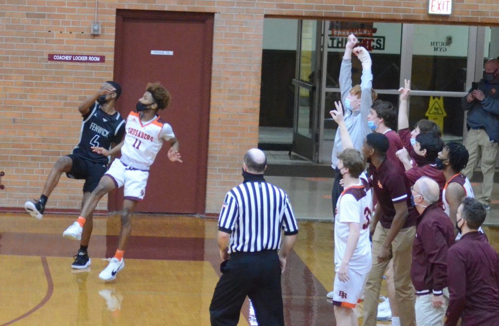 Brother Rice’s Ahmad Henderson shoots a game-winning 3-pointer against Fenwick his sophomore season. He has also had last-second game winners in his junior and senior seasons. Photo by Jeff Vorva