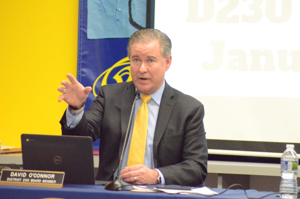 District 230 board member Dave O'Connor urges Sandburg parents to consider having their students take dual credit courses to save college tuition money at the Jan. 26 meeting. (Photo by Jeff Vorva)