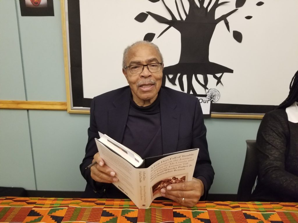 Rev. Wheeler Parker signs a copy of his book about his cousin Emmett Till at the Summit Library. (Photos by Carol McGowan)