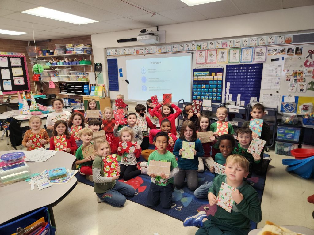 First-graders at Southwest Elementary School in Evergreen Park show off their wrapped books.(Supplied photos)