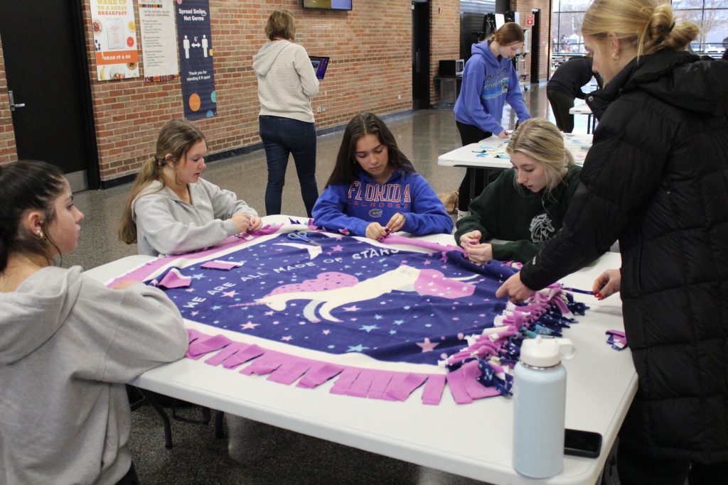 Richards High School students met after school on January 31 in the cafeteria, 10601 Central Avenue in Oak Lawn, to make fleece comfort blankets for pediatric cancer patients at Advocate Hope Children’s Hospital at Christ Medical Center. (Supplied photos)