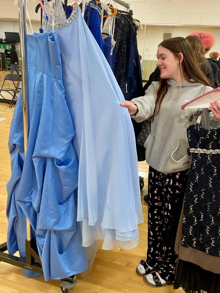 Madi Candos, 17, of Oak Lawn, happily browses for a prom dress at Oak Lawn Community High School's Cinderella's Closet. (Photos by Kelly White)