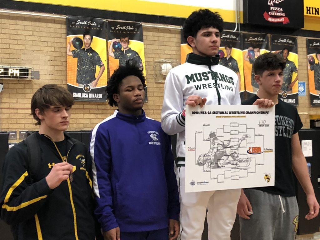 Asael Rubalcava is the first Evergreen Park wrestler to win a sectional championship, which he did Feb. 11 at the IHSA Class 2A Hinsdale South Sectional. Photo by Mike Walsh
