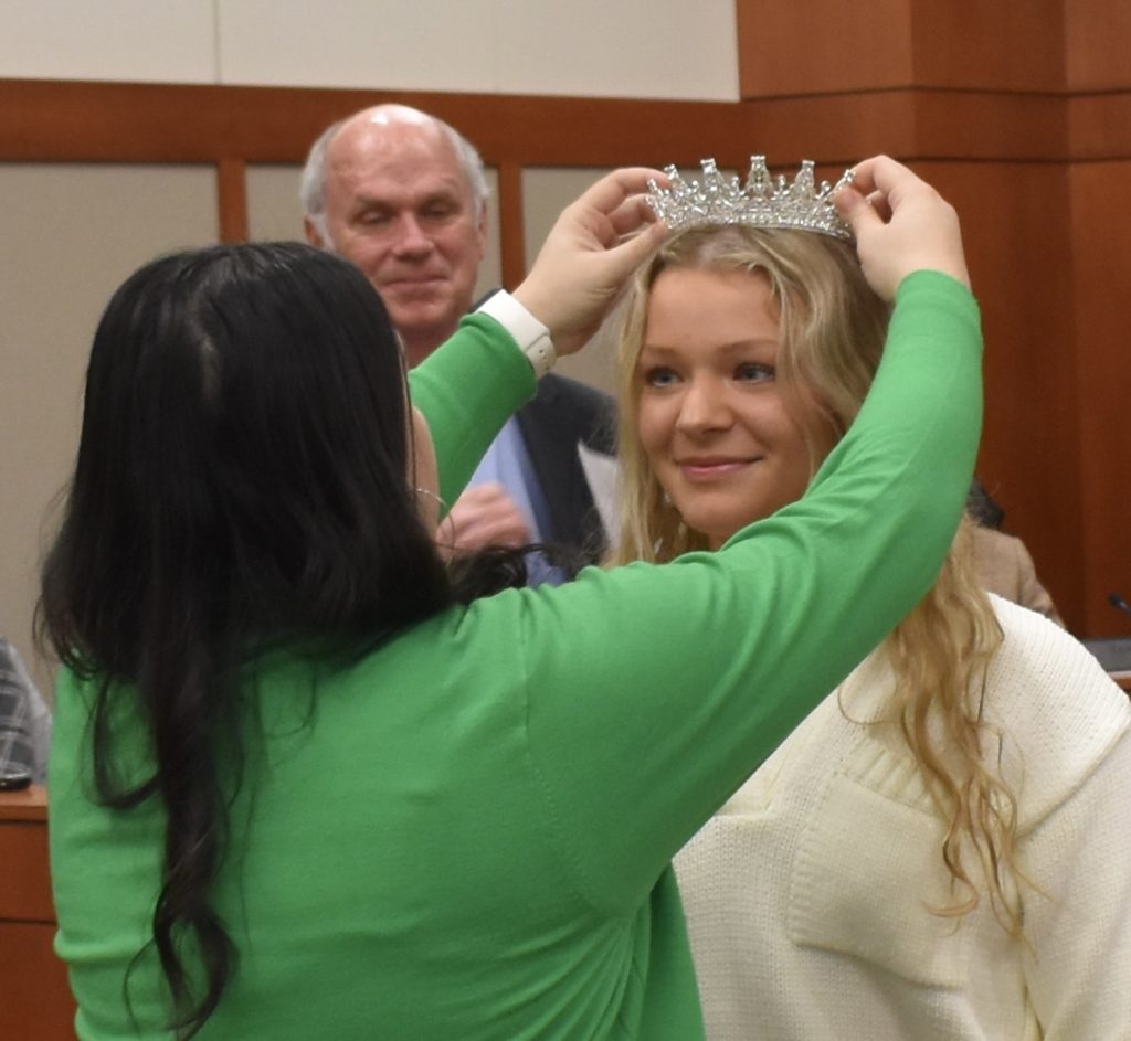 Colleen Ramicone is crowned by administrative clerk Liz Saucedo as queen of Saturday’s St. Patrick’s Day Parade in Countryside. Ald. John Finn (1st Ward) looks on. (Photos by Steve Metsch) 