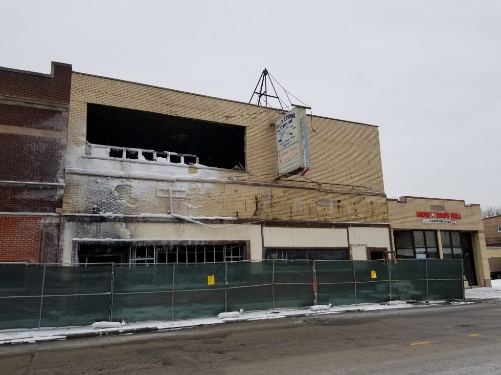 All that's left of Georgis Catering is a burned out shell. To the right, is mom and Dad's Deli, which suffered smoke and water damage. (Photo by Carol McGowan)