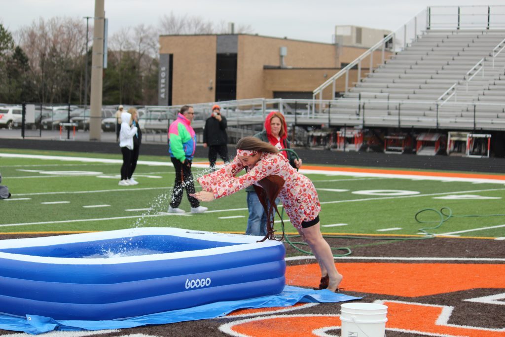 Shepard's Assistant Principal Marie Cerwin dives into chilly waters at Shepard's Polar Plunge on March 2 at the school, 13049 S. Ridgeland Ave., Palos Heights. (Supplied photos)