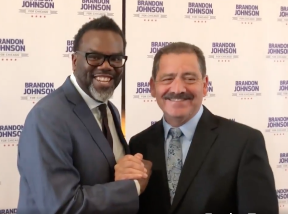U.S. Rep. Jesús “Chuy” García (D-4th) shakes hands with Cook County Commissioner Brandon Johnson (D-1st), moments after the congressman announced his endorsement of Johnson last Friday at La Villita Community Church. --Supplied photo