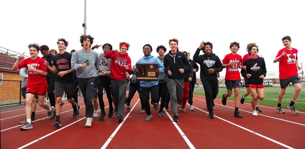Marist's boys track team, here celebrating its sectional title in 2022, got its season underway after the offseason death of coach Jon Gordon. Photo courtesy of Marist High School
