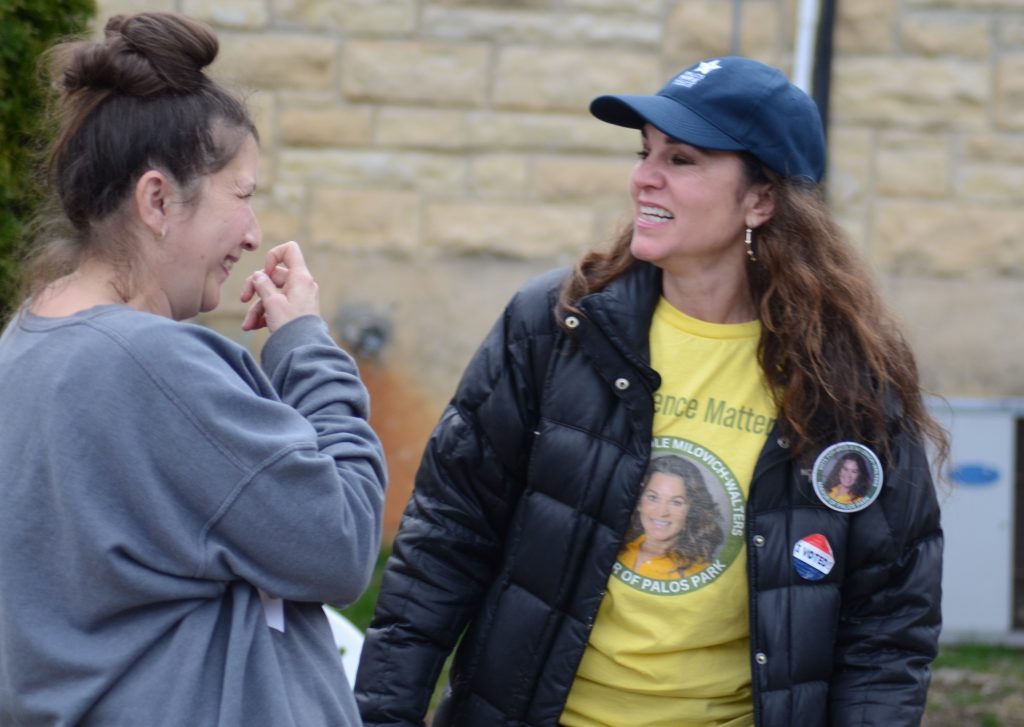 Nicole Milovich Walters (right) has a laugh while campaigning on April 4. She is unofficially the new mayor of Palos Park. (Photos by Jeff Vorva)