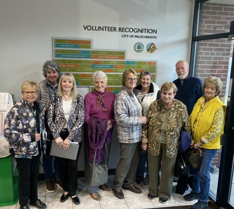 Some volunteers honored on the new wall at City Hall gather for a photo on April 18. (Photo by City of Palos Heights)