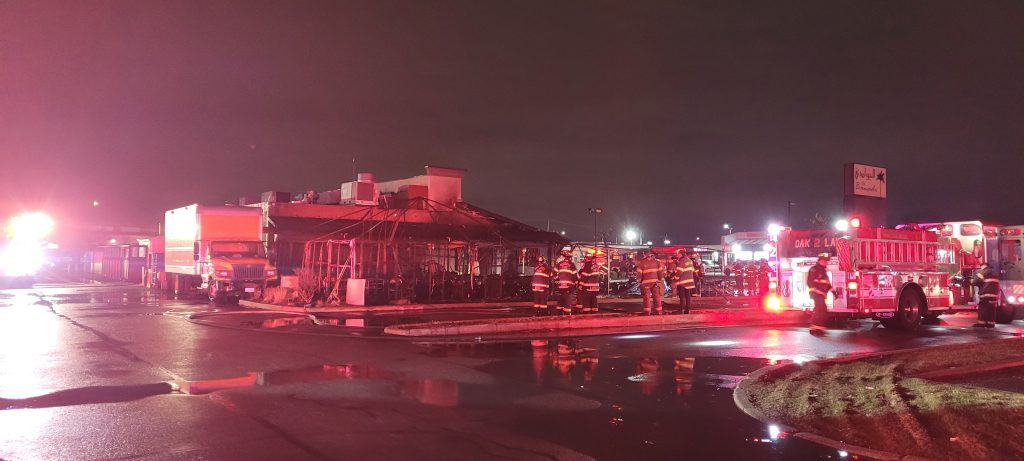Firefighters keep an eye on the burned out tent at Al Bawadi Grill in Bridgeview April 3. (Photo courtesy of Bridgeview Fire Department) 